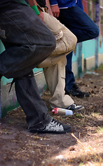 Image showing Graffiti, fashion and shoes of friends at wall for hip hop, street art and creative. Urban, relax and grunge style with sneakers of group of teenagers in park for cool, trendy and spray can