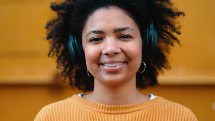 Image showing Black woman, portrait or music headphones on isolated yellow background, fashion mockup or wall mock up. Smile, happy or laughing student listening to radio, audio and podcast in trendy or cool cloth