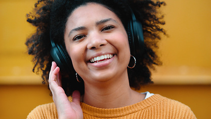 Image showing Black woman, portrait or music headphones on isolated yellow background, fashion mockup or wall mock up. Smile, happy or laughing student listening to radio, audio and podcast in trendy or cool cloth