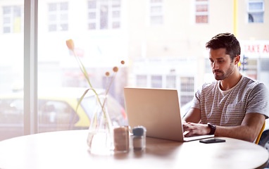 Image showing Coffee shop, online and man with laptop and lens flare doing code work in a cafe. Tech, email and male freelancer customer at a restaurant with mockup and computer writing with focus on web coding