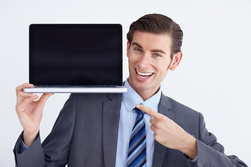 Image showing Mockup, laptop and business man portrait pointing to screen space against a white background. Hands, display and face of male person with computer copy space for advertising, marketing or branding