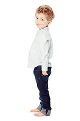 Image showing Cute, smile and portrait of a child with fashion isolated on a white background in a studio. Adorable, happy and a little boy as a clothes model in jeans for youth with happiness and smiling