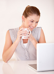 Image showing Relax, coffee and smile with woman and laptop for social media, streaming and website. Technology, internet and networking with female freelancer online at home for remote work, tea and email