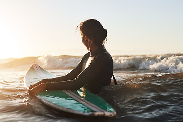 Image showing Sunshine, ocean and woman surfing, fitness and exercise for wellness, balance and healthy lifestyle. Female person, surfer and girl with a surfboard, water sports and seaside for practice or sunlight