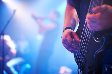 Image showing Guitar, music festival and man with a band on stage for a show, performance or night event. Party, rock and hands of a guitarist on an electric instrument for a concert, musician and entertainment