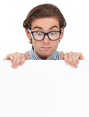 Image showing Looking, shocked and man with poster for mockup in studio isolated on a white background. Board, surprised and male person, geek or nerd with copy space for advertising, marketing or promotion banner
