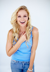 Image showing Portrait, happy woman laughing and good news in white background. Excited or happiness, cheerful or surprised expression and mockup isolated female person with positive smile in studio backdrop