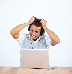 Image showing Angry, laptop and businessman frustrated by glitch or error feeling stress isolated in a white studio background. Anxiety, depression and male employee with mental health issue due to a 404 problem