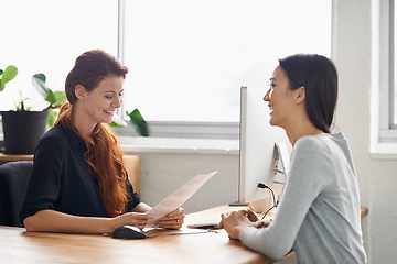 Image showing Resume, job interview and business women in office in conversation, talking and discussion at desk. Communication, partnership and female workers with paperwork for recruitment, cv and hiring review