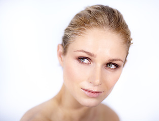 Image showing Skincare, woman and thinking face in white background, studio and isolated for beauty, dermatology and wellness. Female model daydream of aesthetic glow, shine and cosmetic ideas of facial aesthetics