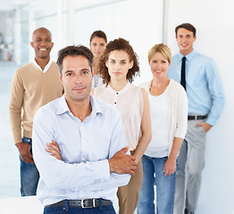 Image showing Portrait, leader and business people with arms crossed for teamwork in office. Collaboration, leadership and employees, men and women with group diversity, team building and solidarity in workplace.