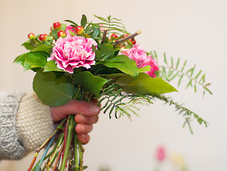 Image showing Closeup, hand and woman with a bouquet, gift and care with beauty, natural and flora. Zoom, female person and girl with flowers, nature and wellness with a present, spring and blooming with blossom