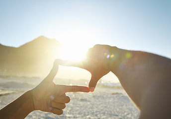 Image showing Pov, hands and frame with sunshine, beach and wellness with sky, getaway and memory of ocean getaway. Closeup, hand and person with sunlight, seaside holiday and summer vacation on a tropical island