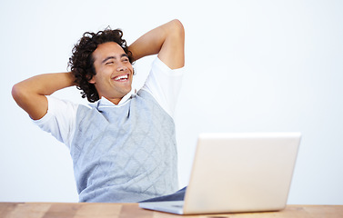 Image showing Relax, laptop and businessman laughing after he complete a task isolated in a white background and an office desk. Calm, finish and male employee or worker smile and rest at work in a company