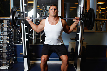 Image showing Gym portrait, barbell and strong fitness man exercising for strength training, muscle building commitment or health lifestyle. Exercise motivation, determined mindset and male athlete weightlifting