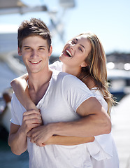 Image showing Happiness, love and portrait of couple on a date together feeling happy on a romantic vacation or holiday in summer. Portrait, travel and woman hug man in a relationship and smile outdoor with care