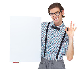 Image showing Ok sign, portrait and man with poster for mockup in studio isolated on a white background. Board, okay hand gesture and male person, geek or nerd with smile for copy space, advertising and glasses.