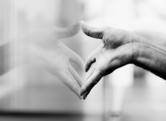 Image showing Closeup, window and hand with a reflection, glass and grey with monochrome and aesthetic. Zoom, person and model with light, design or fingers with art, interior and press with creativity or artistic