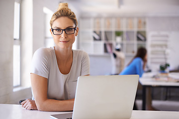 Image showing Laptop, fashion and confidence with portrait of woman in office for creative retail planning. Small business, industry and technology with female designer for workshop, entrepreneurship and tailor