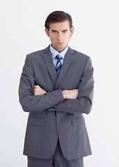 Image showing Anger, crossed arms and portrait of business man on white background with upset, mad and angry expression. Employee, professional and face of male worker with stress, frustrated and annoyed in studio