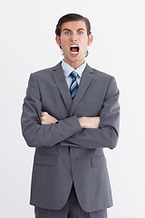 Image showing Anger, shout and portrait of business man on white background with upset, shouting and angry expression. Manager, professional and male worker with stress, frustrated and crossed arms in studio