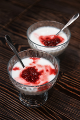 Image showing Raspberry yougurt on wooden