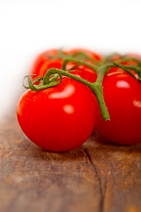 Image showing fresh cherry tomatoes on a cluster