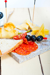 Image showing mix cold cut on a stone with fresh pears