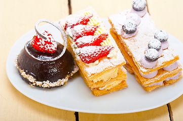 Image showing selection of fresh cream cake dessert plate