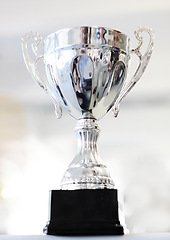 Image showing Trophy, reward and celebration award as an achievement for winning a silver prize due to success of a champion. Shine, cup and victory championship with value for a winner in a competition