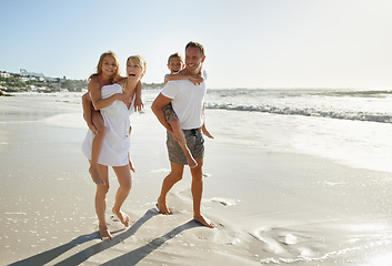 Image showing Family, beach and fun of mother, father and kids together with a piggy back outdoor in nature. Sea, smile and happiness with bonding, parent support and love while laughing by the ocean on holiday