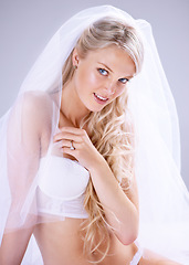 Image showing Portrait, wedding and young bride in bra or with lace veil for .lingerie or makeup and hairstyle. Happy, newlywed and woman with diamond ring or underwear ready for marriage in grey background