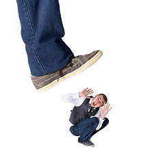 Image showing Isolated foot, squash and scared man with screaming, anxiety and problem by white background. Giant shoes, businessman and mental health with fear, shouting and stop hand gesture by studio backdrop