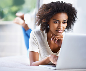 Image showing Thinking, ideas and woman with a laptop, search website and blogging with thoughts, online reading and happiness. Female person, lady or model with technology, home and cheerful with wonder and email