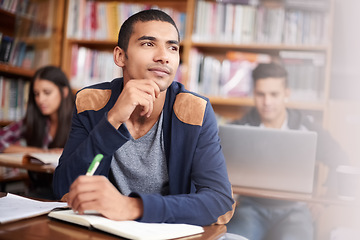 Image showing Study, writing and thinking with man in library for education, research and classroom quiz. Focus, learning and notebook with male student on university campus for knowledge, scholarship and project