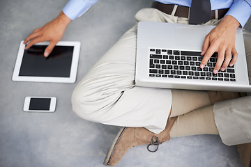 Image showing Laptop, tablet and hands of man with technology, phone and mobile tech for online research, internet search or business. Typing project, UI screen or top view of professional person sitting on floor