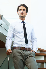 Image showing Corporate, businessman with professional outfit on stairs. Business office worker or accountant, young executive or employee looking focused and elegant with person thinking at workplace on steps