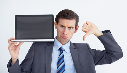 Image showing Fail, thumbs down and laptop by business man portrait in studio unhappy, bad and disappointed on white background. Face, frown and negative review emoji by male person with online feedback or vote