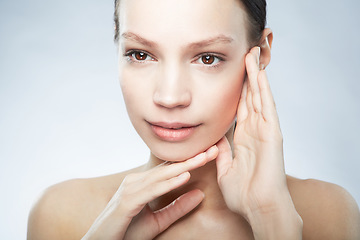 Image showing Skincare, beauty and woman with hands on face isolated on studio background with mockup space. Dermatology, cosmetics and skin care model with facial makeup and luxury spa treatment for healthy glow.