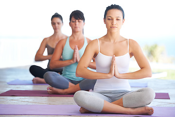 Image showing Peace, meditation class and woman with zen and yoga exercise outdoor with a pilates instructor. Spiritual, namaste and wellness of training, workout and fitness group feeling calm from meditating