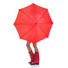 Image showing Cover, weather and woman holding a red umbrella, wearing gumboots and girl isolated against a white studio background. Female person, lady and model with insurance, protection and winter outfit
