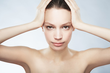 Image showing Skincare, face portrait and a woman with beauty from treatment isolated on a white background in studio. Serious, young and a female model for dermatology and cosmetics on a backdrop for care of skin