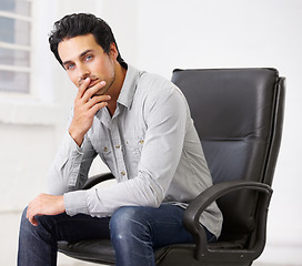 Image showing Portrait, business or man on chair in office thinking with pride for career, job or work. Professional, male entrepreneur and serious decision or employee, ceo or person sitting in startup workplace