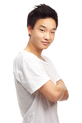 Image showing Young asian man, portrait and arms crossed with smile, confidence and happiness by white background. Isolated japanese model, guy and happy with t-shirt, clothes or gen z aesthetic by studio backdrop