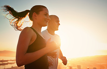 Image showing Sunrise, fitness and happy couple running as workout or morning exercise for health and wellness together. Sport, man and woman runner run with athlete as training in a city for sports with energy