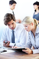 Image showing Collaboration, writing or documents with a business team in a boardroom working together on a project. Teamwork, planning or strategy with men and women employees at work in the office for discussion