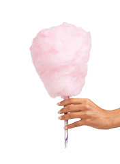 Image showing Cotton candy, sweet and woman hands isolated on a white background for snack, pink food and holiday treat. Person hand holding, giving or offer color cone for youth, childhood and festival in studio