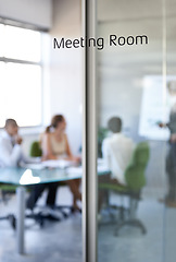 Image showing Boardroom, business and team collaboration in a meeting room with company and office glass sign. Management, presentation and conference in the workplace with a workshop and teamwork planning.