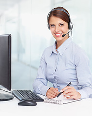 Image showing Portrait business woman, call center and writing notes in book for customer service, support or telesales at office. Happy of female consultant with smile and notebook for online advice at workplace