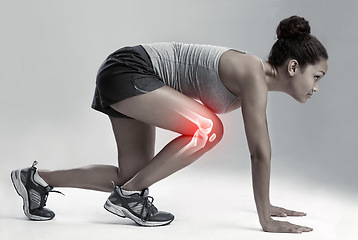 Image showing Woman, running and start with knee x ray for injury, workout or sport accident against a gray studio background. Female runner in skeleton pain with sore leg, ache or bone from exercising or training